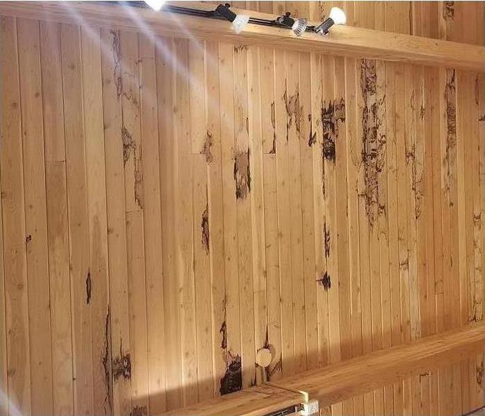 Before restoring wood in retail store from water damage