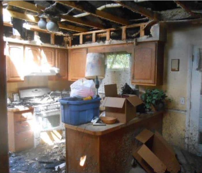 Storm and fire damage destroying kitchen