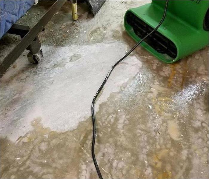 Air mover on a water affected floor.