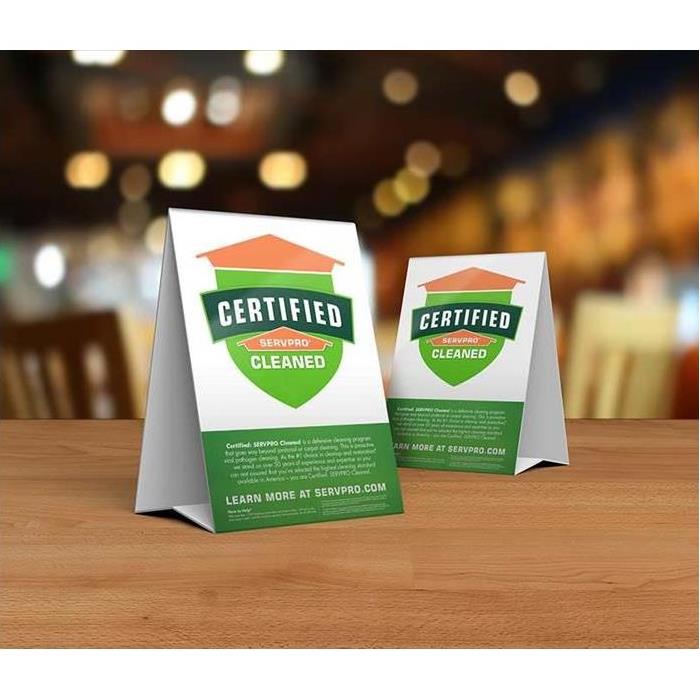 Two table top folding advertisements promoting the Certified: SERVPRO Cleaned Program.