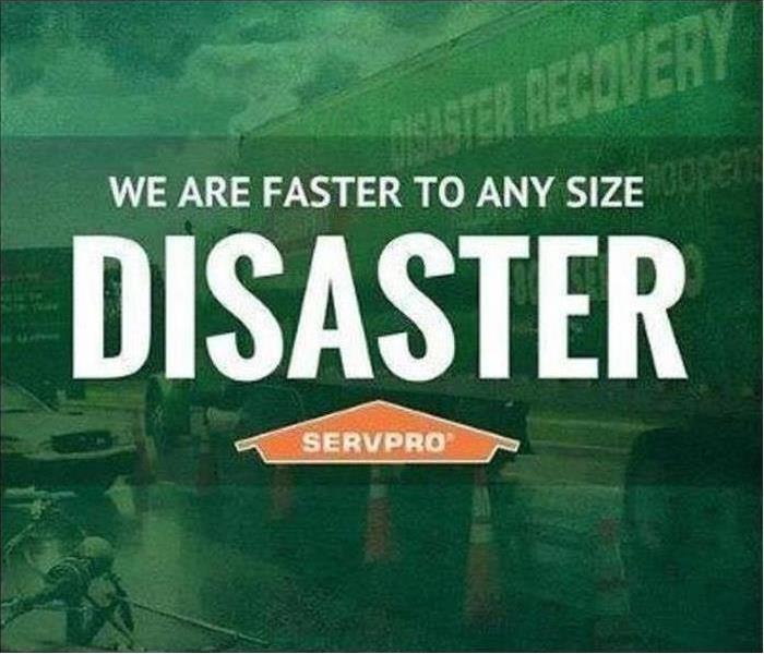 SERVPRO semi outside of storm damaged property with "We are faster to any size disaster" 