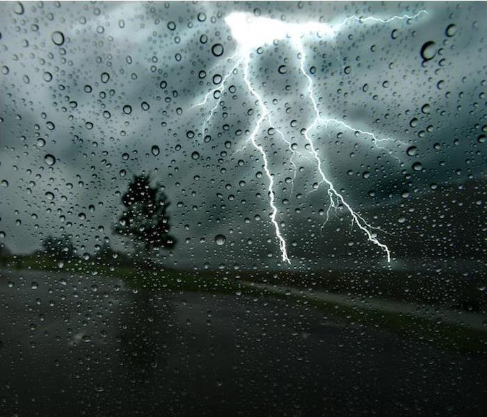 Lightning seen through a car windshield.